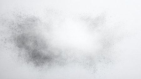 This image features an abstract smoky texture in grayscale, created with fine particles against a clean white background, perfect for various design projects.の素材