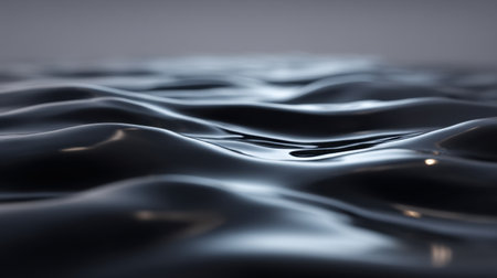 Captivating image of a smooth liquid surface displaying gentle waves and soft light reflections, ideal for creative projects needing a minimalist touch.の素材