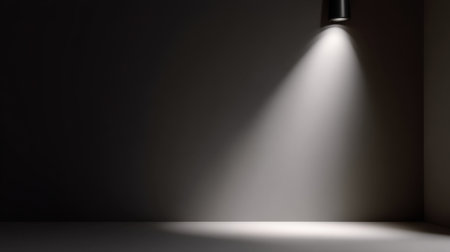 A captivating image of a dark room with a single beam of light creating a dramatic effect, emphasizing the minimalist design and evoking a sense of mystery and calm.の素材