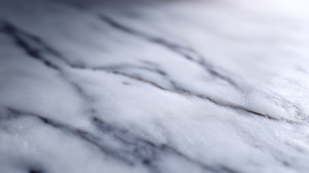 A stunning close-up of a white marble surface showcasing subtle gray veins, ideal for interior design projects, textures, and creative decor inspiration.の素材