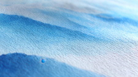 This image features a soft blue watercolor background with subtle textures and gentle gradients, perfect for artistic designs, creative projects, or visual inspiration.の素材