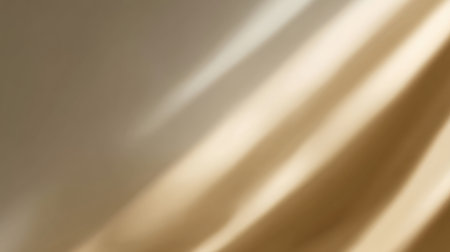 This image features soft golden fabric draped elegantly, catching gentle light. The abstract design creates a warm, soothing atmosphere perfect for elegant projects.の素材