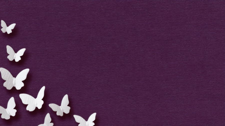 A serene collection of white butterflies gracefully scattered on a rich purple textured surface, offering a stylish touch perfect for artistic endeavors or design projects.の素材