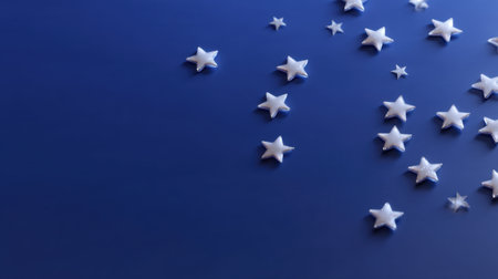 A visually appealing arrangement of white stars scattered on a deep blue background, perfect for enhancing creative projects, decor ideas, and celestial-themed designs.の素材