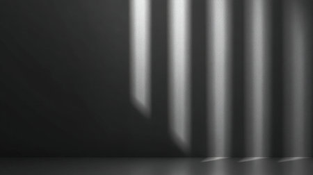This image features abstract light shadows on a dark surface, creating an elegant and minimalist artistic composition perfect for various creative projects.の素材