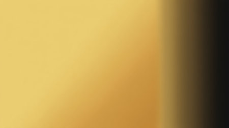 This abstract golden background features a smooth gradient and soft texture, ideal for creating an inviting atmosphere in design projects and artistic expressions.の素材