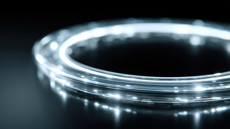 A captivating circular light pattern set against a dark background showcases a mix of glowing elements, creating a futuristic and modern aesthetic ideal for creative projects.の素材