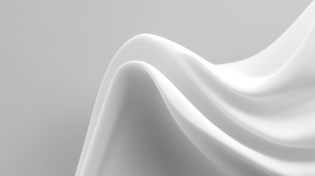 An elegant view of soft white fabric draping gracefully over a surface. The smooth curves and minimalist design evoke a sense of serenity and modernity.の素材