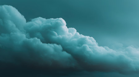 A stunning portrayal of fluffy clouds set against a turquoise sky, creating a dramatic and tranquil atmosphere perfect for artistic and scenic themes.の素材