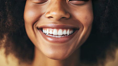 A person's warm smile, revealing dimples in their cheeks.の素材