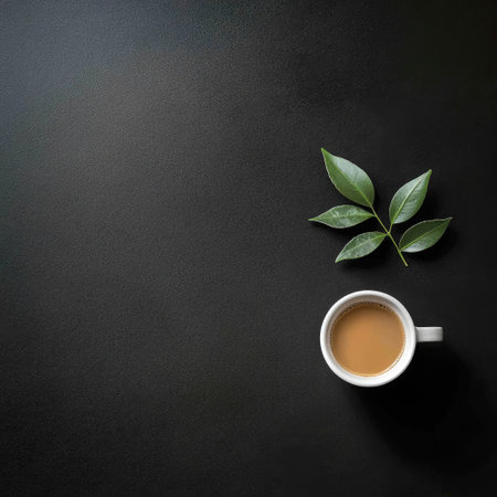 top view minimalist design with a sleek black surface, a white coffee cup, and a single green leaf placed in the cornerの素材