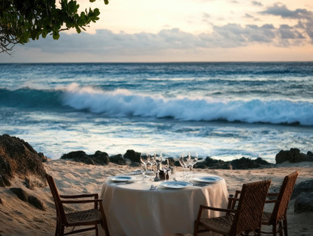 Outdoor dining on a remote beach, with a full-course meal served beside the crashing wavesの素材