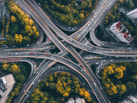 A complex highway intersection from an aerial view, showing multiple roads crossing over each otherの素材