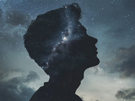 Double exposure night sky with a person, stars and galaxies blending into a silhouetteの素材