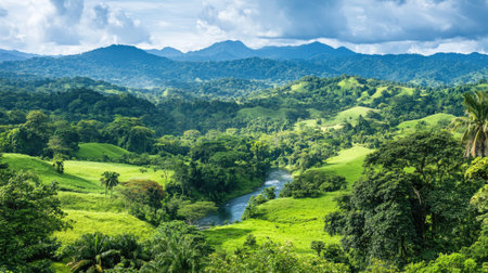 Discover a stunning landscape featuring a winding river surrounded by lush greenery and majestic mountains under a vibrant sky, perfect for nature lovers.の素材