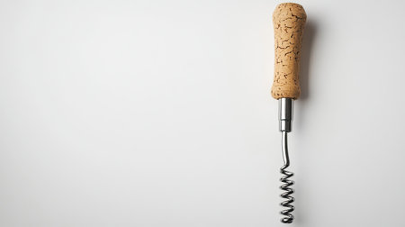 A close-up image of a corkscrew with a wooden handle, set against a clean white background. Ideal for promoting wine-related products or services.の素材