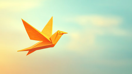 A vibrant yellow origami bird soars gracefully through a serene blue sky, evoking feelings of freedom and creativity. Perfect for artistic themes.の素材