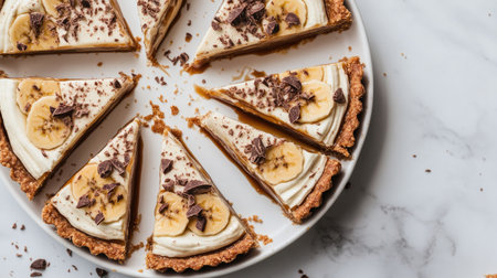 Enjoy a tempting display of banana cream pie slices topped with chocolate and whipped cream, perfect for any celebration or dessert table.の素材