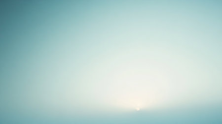 A serene and calming image of a soft sunrise exhibiting a gentle gradient of light, creating a tranquil atmosphere perfect for relaxation and inspiration.の素材