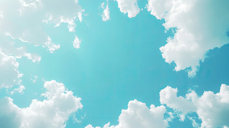 A stunning view of a bright blue sky filled with fluffy white clouds. This serene image captures the beauty of nature and the tranquility of a sunny day.の素材