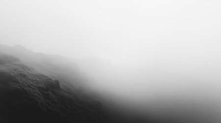 A foggy landscape featuring rocky terrain shrouded in mist. This monochrome image captures a tranquil and mysterious atmosphere, perfect for artistic projects.の素材