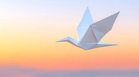 A delicate origami bird soars gracefully against a soft sunset sky, capturing a moment of tranquility and artistic beauty in paper craftsmanship.の素材