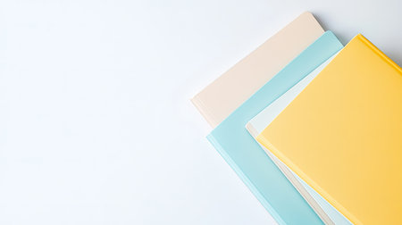 A collection of colorful notebooks arranged neatly on a light background. Ideal for concepts related to education, creativity, and organization.の素材