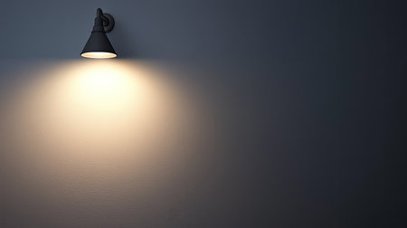 A minimalistic interior shot showcasing a soft light fixture illuminating a blank wall, creating a tranquil ambiance and inviting warmth, perfect for modern decor.の素材