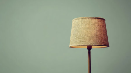 A stylish vintage lamp emits a warm glow against a soft green background, enhancing the cozy atmosphere of any living space. Perfect for interior decor.の素材