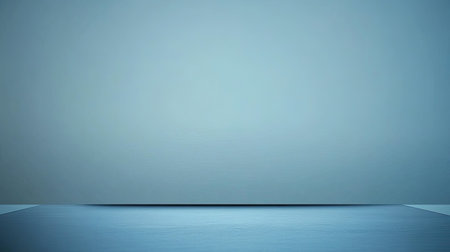 A minimalist office space featuring a sleek desk against a blank wall, ideal for creative inspiration and a calm working atmosphere.の素材