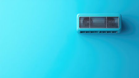 A modern air conditioning unit mounted on a vibrant blue wall, offering a cool and stylish atmosphere for any living space or interior environment.の素材