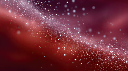 Vivid cosmic background featuring shimmering particles against a blurred red and purple gradient, perfect for creative projects, art, and digital themes.の素材