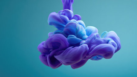 A stunning display of vibrant purple and blue ink swirling in water creates captivating abstract visuals against a soft aquamarine backdrop, perfect for art and design projects.の素材