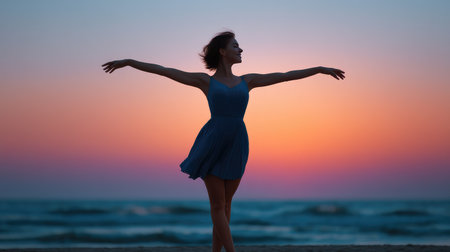 A beautiful silhouette of a woman dancing joyfully on the beach at sunset, surrounded by a stunning colorful sky, evoking feelings of freedom and tranquility.の素材