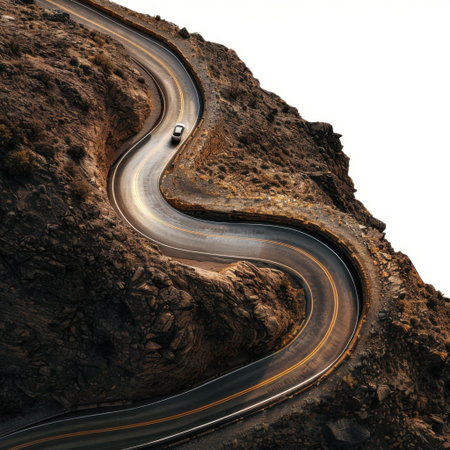 A breathtaking view of a winding road cutting through rugged mountainous terrain, inviting travelers to embrace adventure amidst stunning natural beauty.の素材