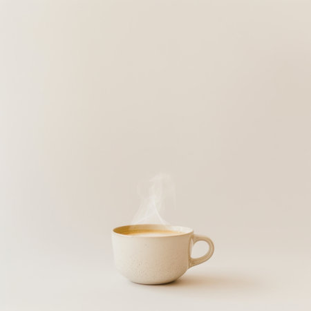 A steaming cup of hot beverage sits on a soft, minimalistic background, creating a serene atmosphere that evokes comfort and warmth in a cozy setting.の素材