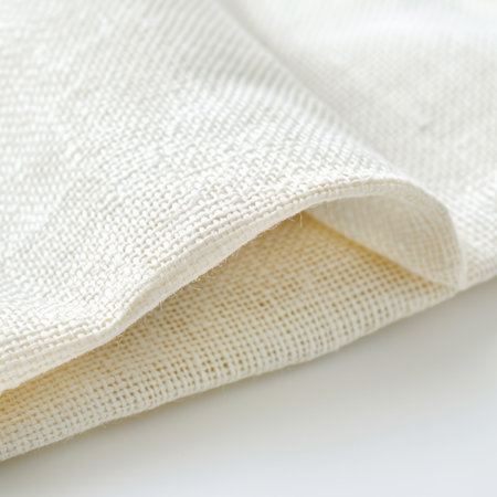 Explore the intricate details of a soft natural fabric close-up. This textile showcases weaving artistry, ideal for various fashion and home decor projects.の素材