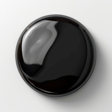 A sleek glossy black sphere sits gracefully on a white background, showcasing its smooth finish and elegant reflective surface. Perfect for modern design projects.の素材