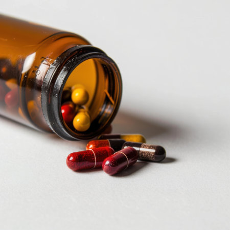 This image captures an amber pill bottle tipped over with colorful capsules spilling out, highlighting themes of health and wellness in a modern, clean setting.の素材