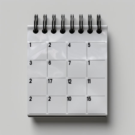 This image features a simple white calendar with spiral binding, displaying a clean layout of the days of the month. Ideal for planning and organization.の素材