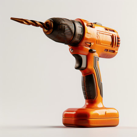 A vivid orange cordless drill with a metallic bit, ideal for construction and home projects. Perfect for DIY enthusiasts and professionals alike.の素材