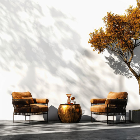A serene outdoor setting featuring modern furniture, a stylish table, and a vibrant tree casting gentle shadows, perfect for relaxation and socialization.の素材