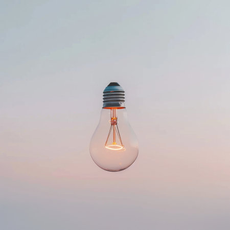 A graceful light bulb exudes warmth with its soft glow against a gentle gradient backdrop, perfect for modern decor and artistic concepts in contemporary projects.の素材