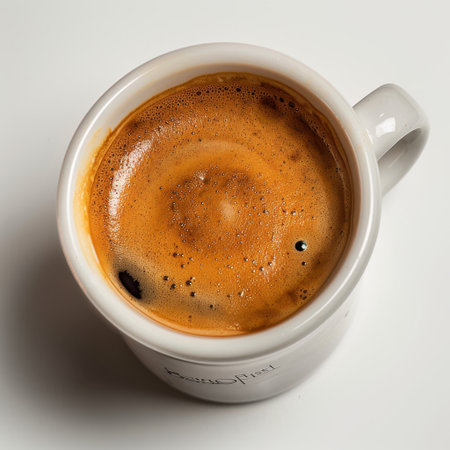 A captivating close-up of freshly brewed espresso showcasing rich colors and creamy foam, perfect for coffee lovers seeking warmth and indulgence in their daily routine.の素材