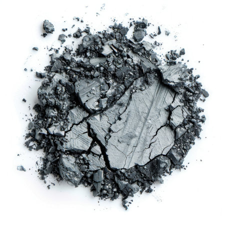 This image shows a pile of fine dark gray ash powder boasting unique patterns and textures, perfect for use in creative projects or industrial themes.の素材