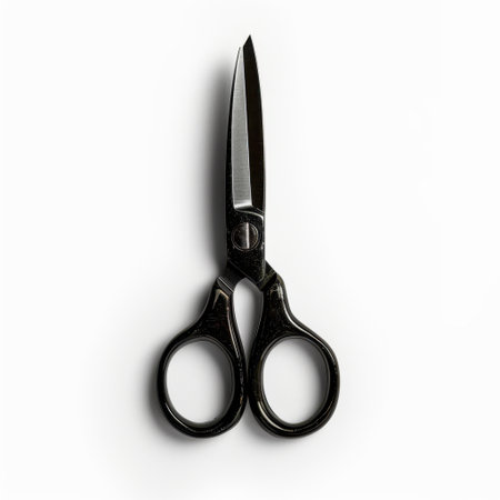 This image features a sleek black pair of scissors with sharp blades, perfect for various uses in crafting, tailoring, and office tasks, set against a clean white background.の素材