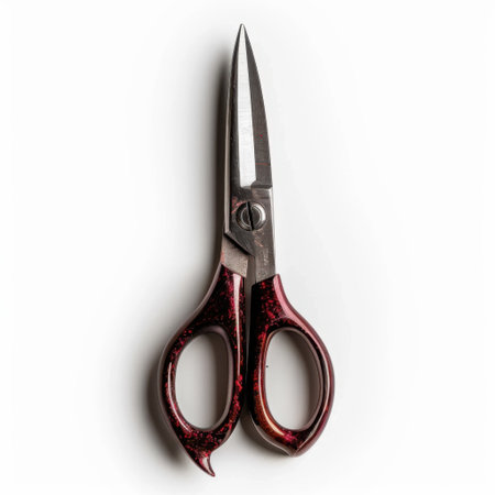 A stunning pair of high-quality scissors featuring a red handle, ideal for cutting paper, fabric, and other materials. Perfect for crafts, office tasks, and creative projects.の素材