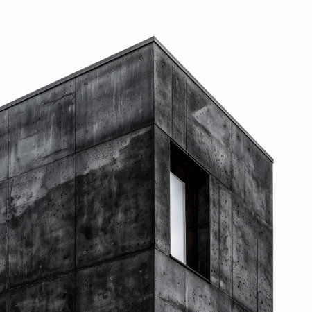 This image showcases a modern building with a striking concrete facade, emphasizing minimalist design elements and sharp lines that evoke contemporary urban architecture.の素材