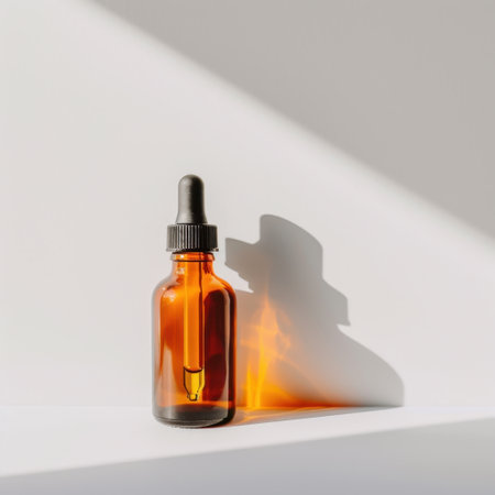 An elegant amber glass dropper bottle with a pipette, elegantly displayed in natural light, creating soft shadows. Ideal for wellness and cosmetic products.の素材