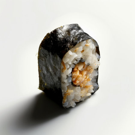 This image features a beautifully crafted sushi roll showcasing crisp rice and savory fish wrapped in nori, perfect for food blogs, menus, and culinary displays.の素材